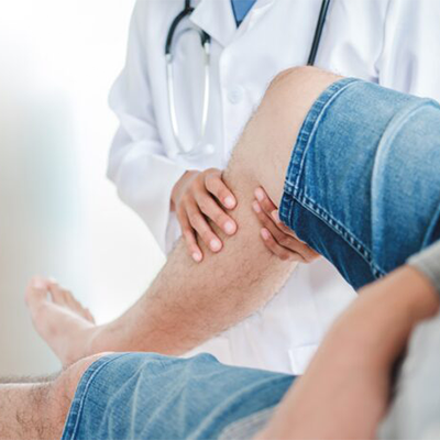 doctor-consulting-with-patient-knee-problems-physi-2022-11-09-06-47-48-utc-700x467